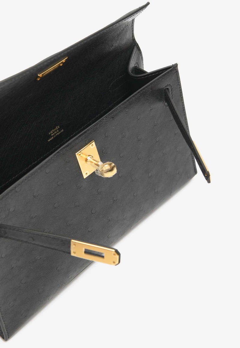 Kelly Pochette Clutch Bag in Black Ostrich Leather with Gold Hardware