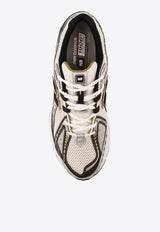 1906R Low-Top Sneakers in Metallic Silver with Metallic Gold